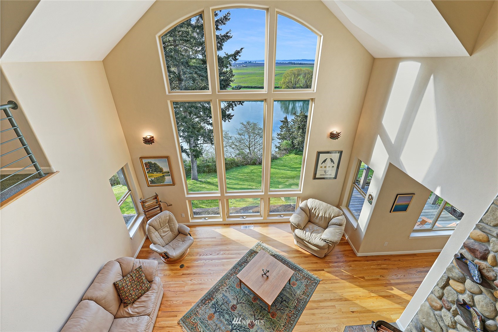 19695 Landing Road Mount Vernon, WA 98273 - Photo 10 of 40 a living room with furniture and a floor to ceiling window
