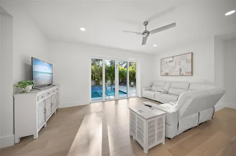 a bedroom with a bed and a large window with the outer view