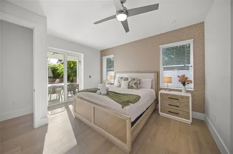 a bathroom with a double vanity sink mirror and shower
