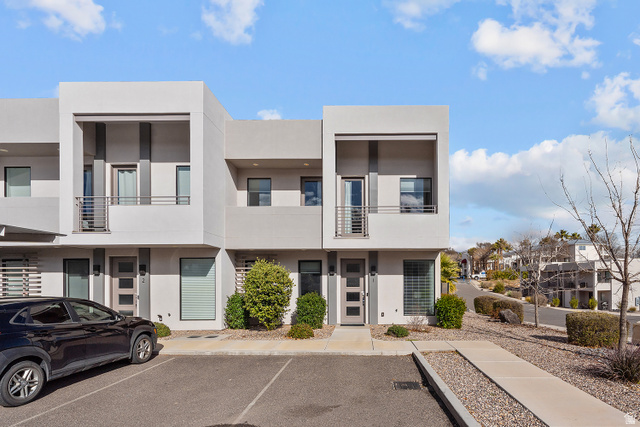 1122 South 1790th West, Unit 1 St. George, UT 84770 - Photo 1 of 37 Contemporary exterior with light gray stucco and dark gray accents