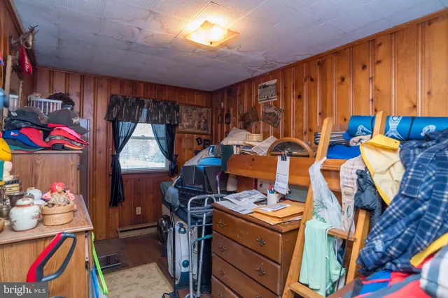 a utility room with dryer washer and a view of living area