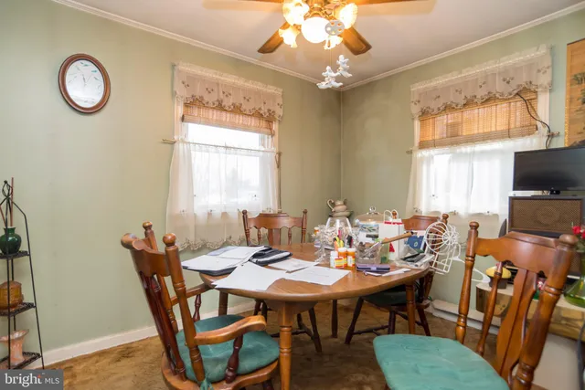 a living room with lots of furniture and chandelier