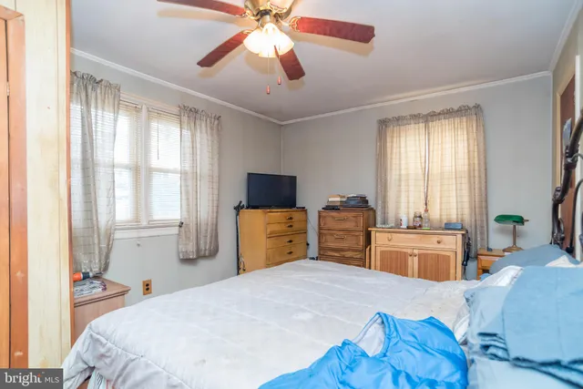 a bed room with a bed and a television