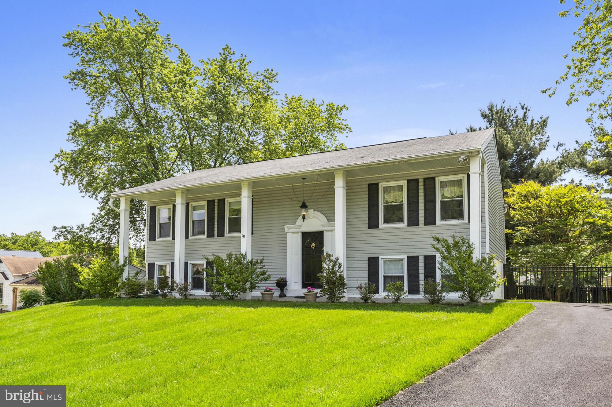 6501 Darwin Road Laurel, MD 20707 - Photo 1 of 30 a front view of a house with garden