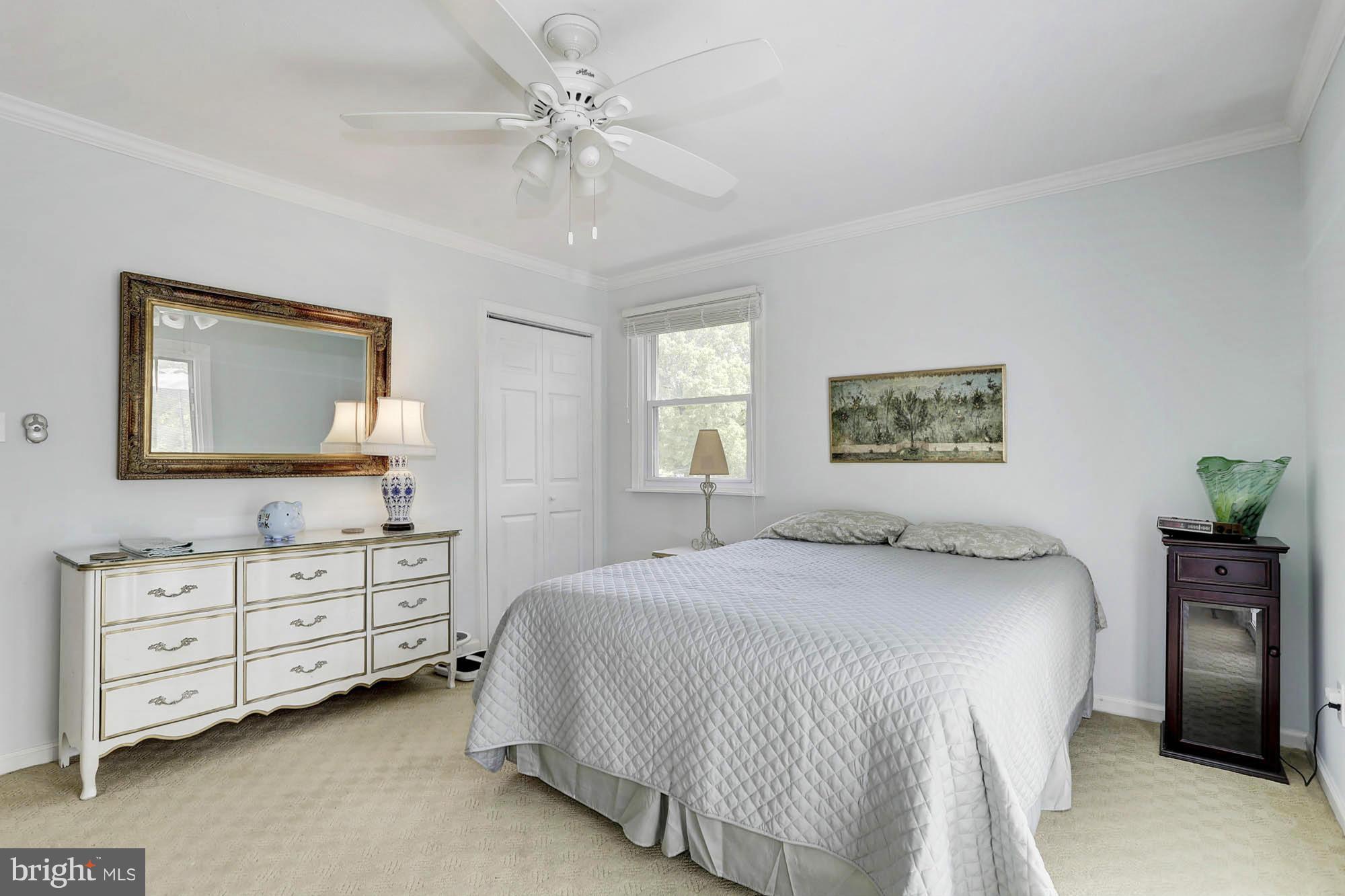 6501 Darwin Road Laurel, MD 20707 - Photo 11 of 30 a bedroom with a bed and a dresser