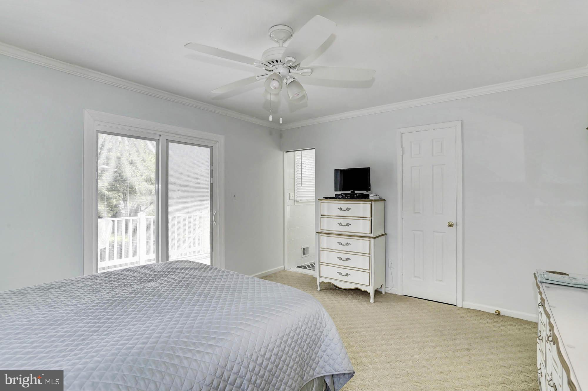 6501 Darwin Road Laurel, MD 20707 - Photo 12 of 30 a bedroom with a bed and a tv on the dresser