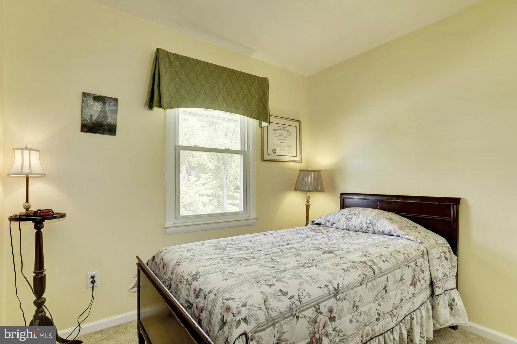 6501 Darwin Road Laurel, MD 20707 - Photo 17 of 30 a bedroom with a bed and a window