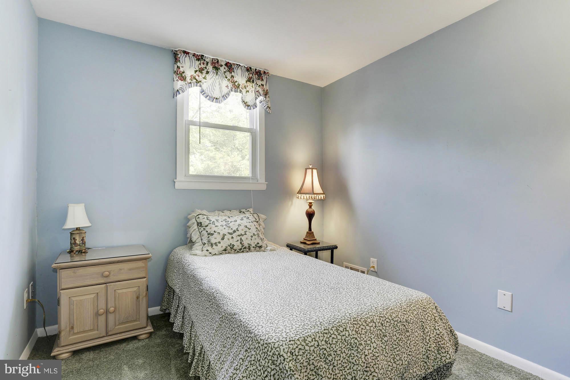 6501 Darwin Road Laurel, MD 20707 - Photo 22 of 30 a bedroom with a bed and window