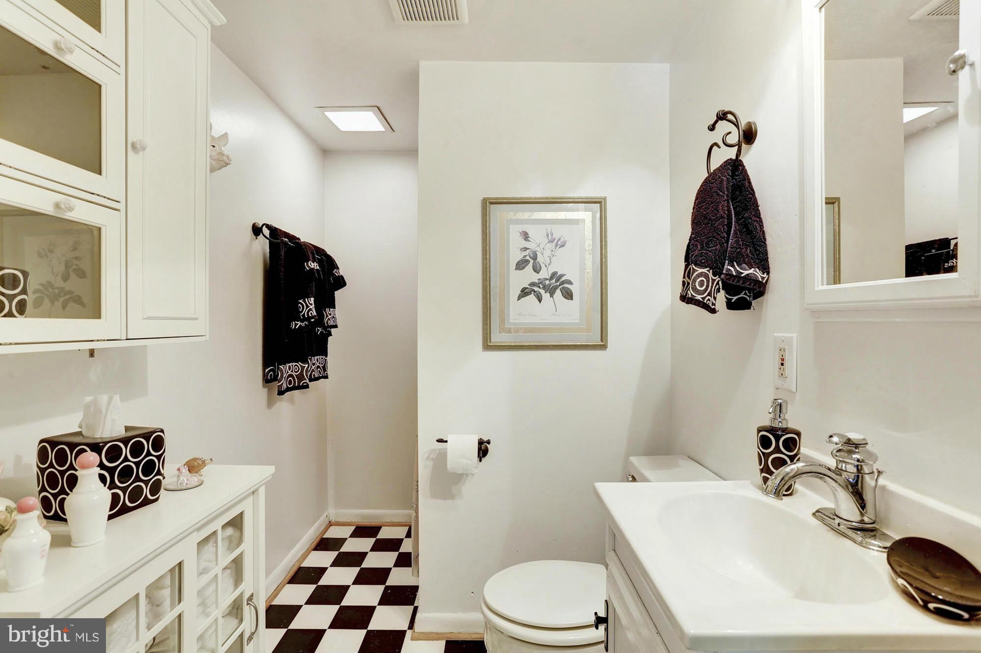 6501 Darwin Road Laurel, MD 20707 - Photo 24 of 30 a bathroom with a sink toilet and shower