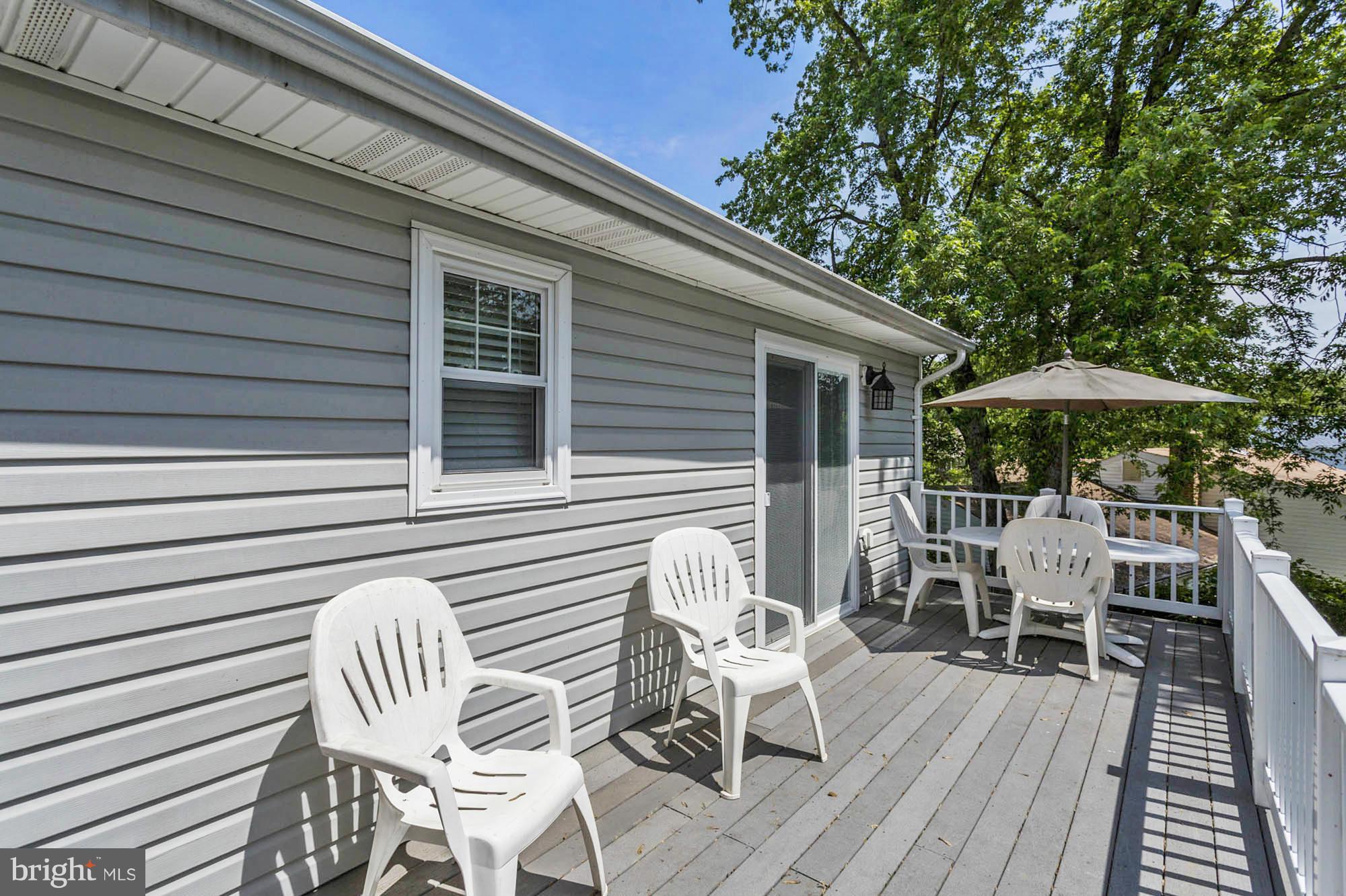 6501 Darwin Road Laurel, MD 20707 - Photo 27 of 30 a view of wooden chairs and table in patio