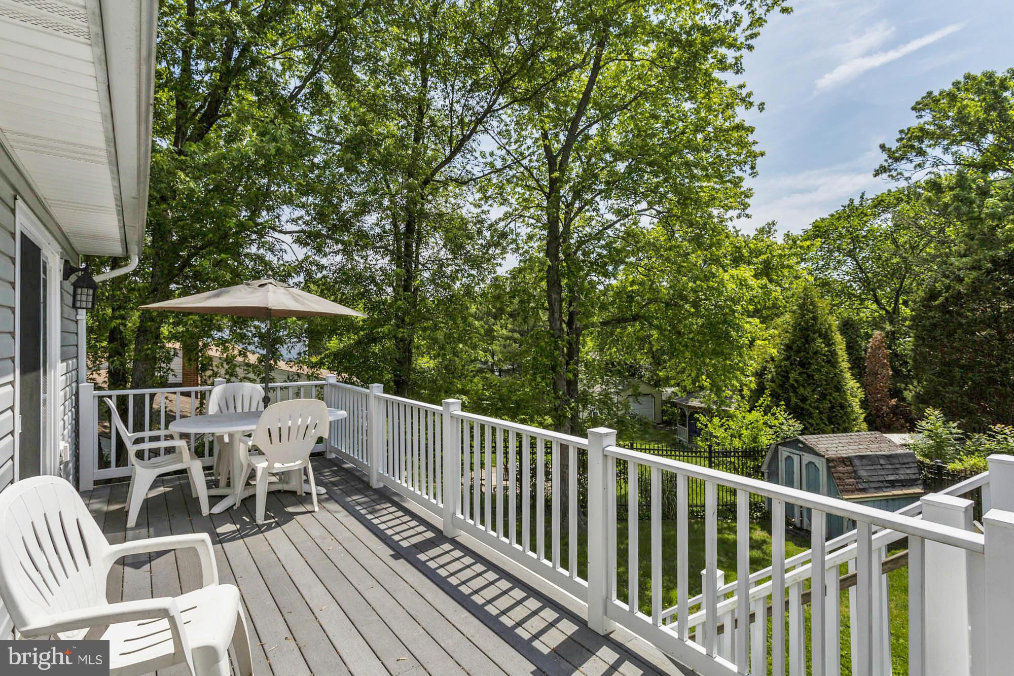 6501 Darwin Road Laurel, MD 20707 - Photo 28 of 30 a view of a deck with furniture and trees