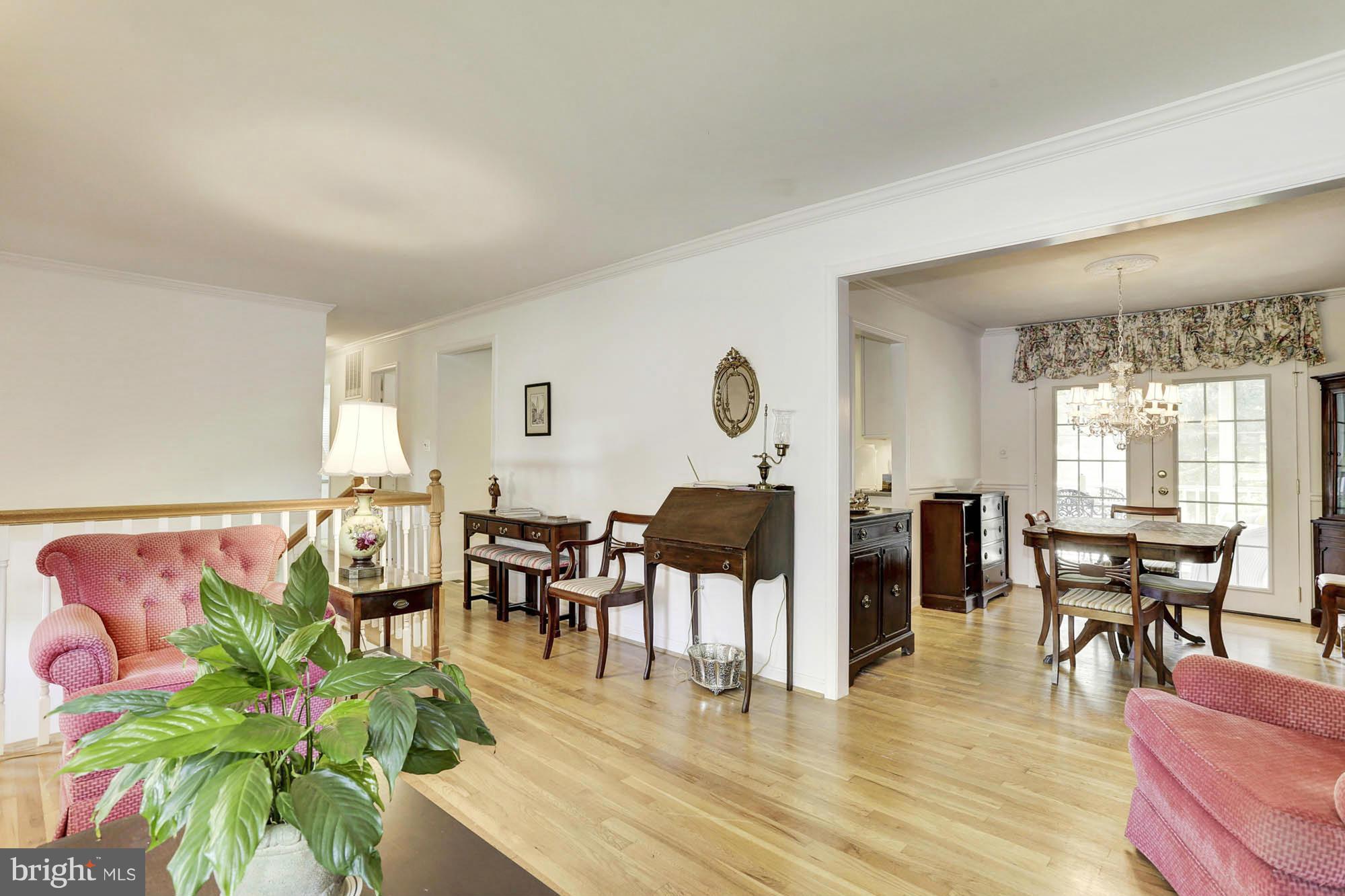 6501 Darwin Road Laurel, MD 20707 - Photo 5 of 30 a view of a dining room with furniture and wooden floor