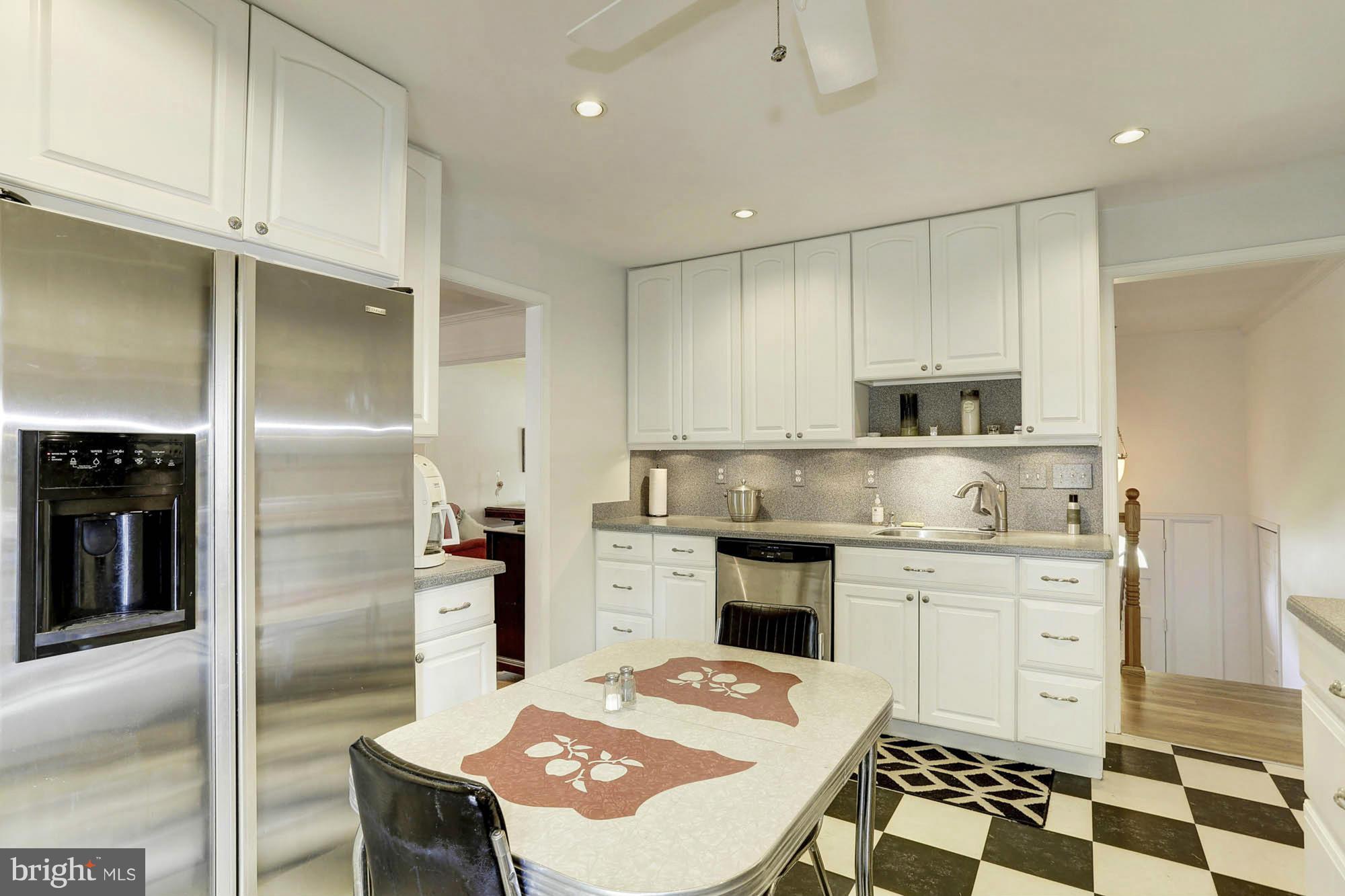 6501 Darwin Road Laurel, MD 20707 - Photo 8 of 30 a kitchen with a sink stainless steel appliances and white cabinets