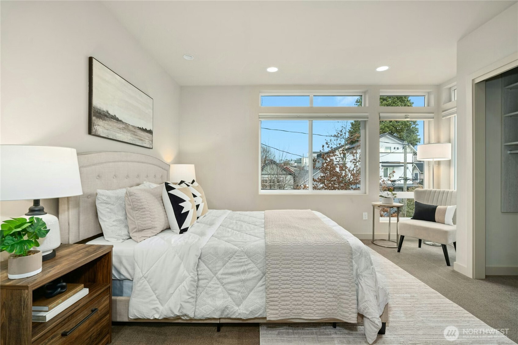 1743 Northwest 60th Street, Unit A Seattle, WA 98107 - Photo 12 of 33 a bedroom with a bed and a large window