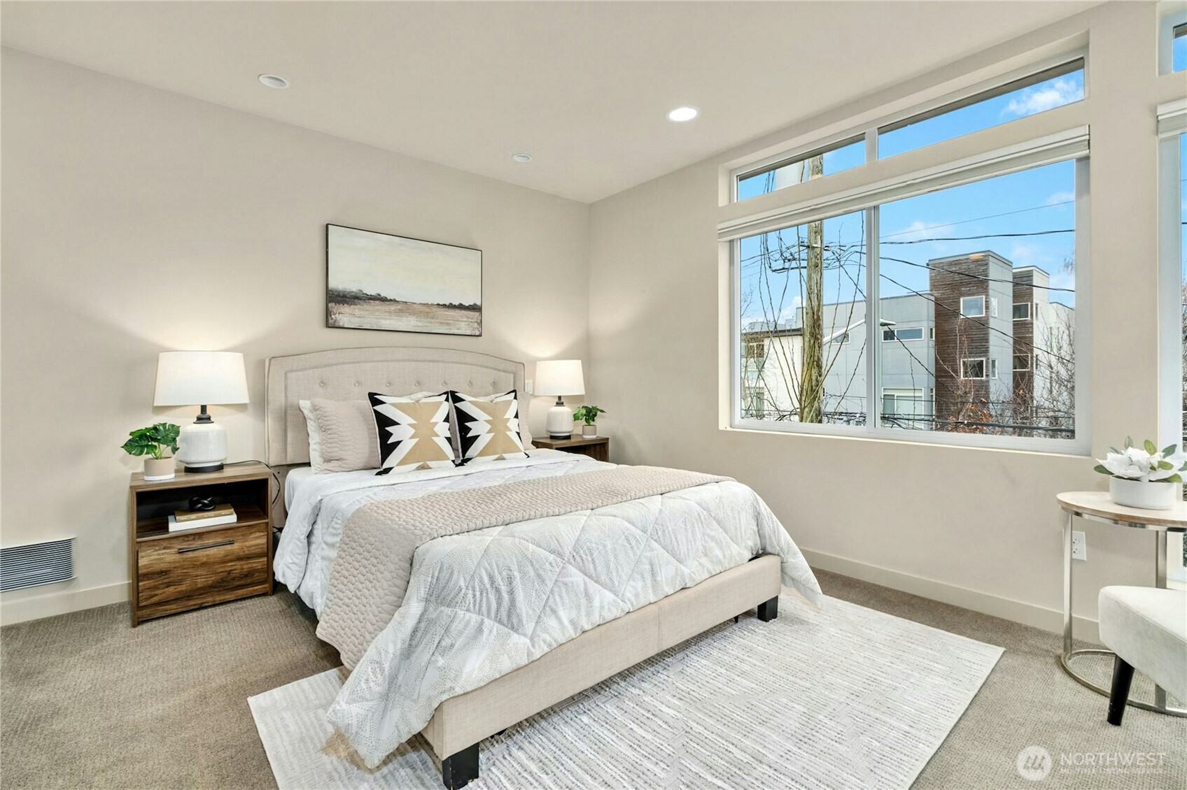 1743 Northwest 60th Street, Unit A Seattle, WA 98107 - Photo 13 of 33 a bedroom with a bed and wooden floor