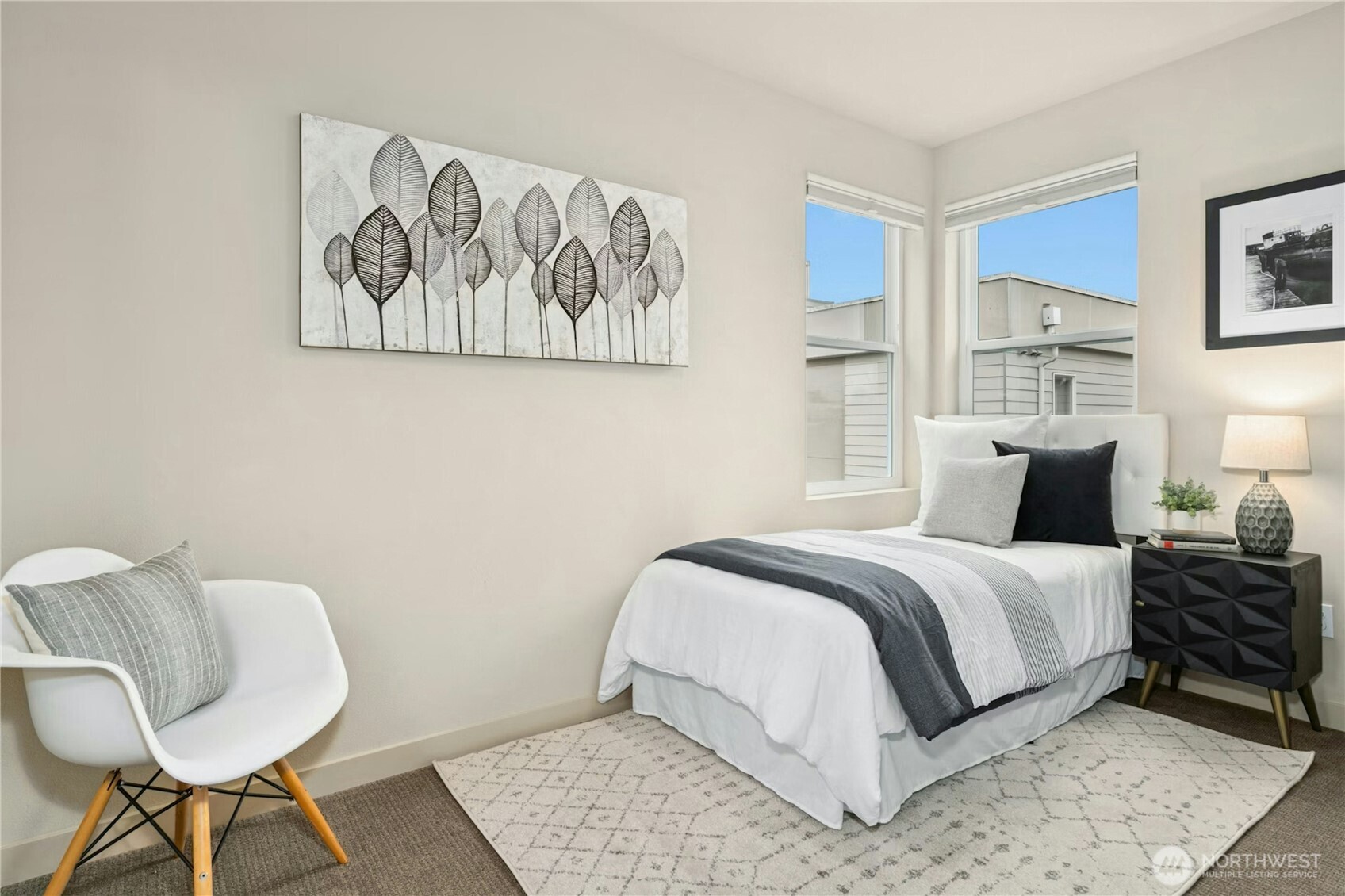 1743 Northwest 60th Street, Unit A Seattle, WA 98107 - Photo 18 of 33 a bed room with a bed and chair