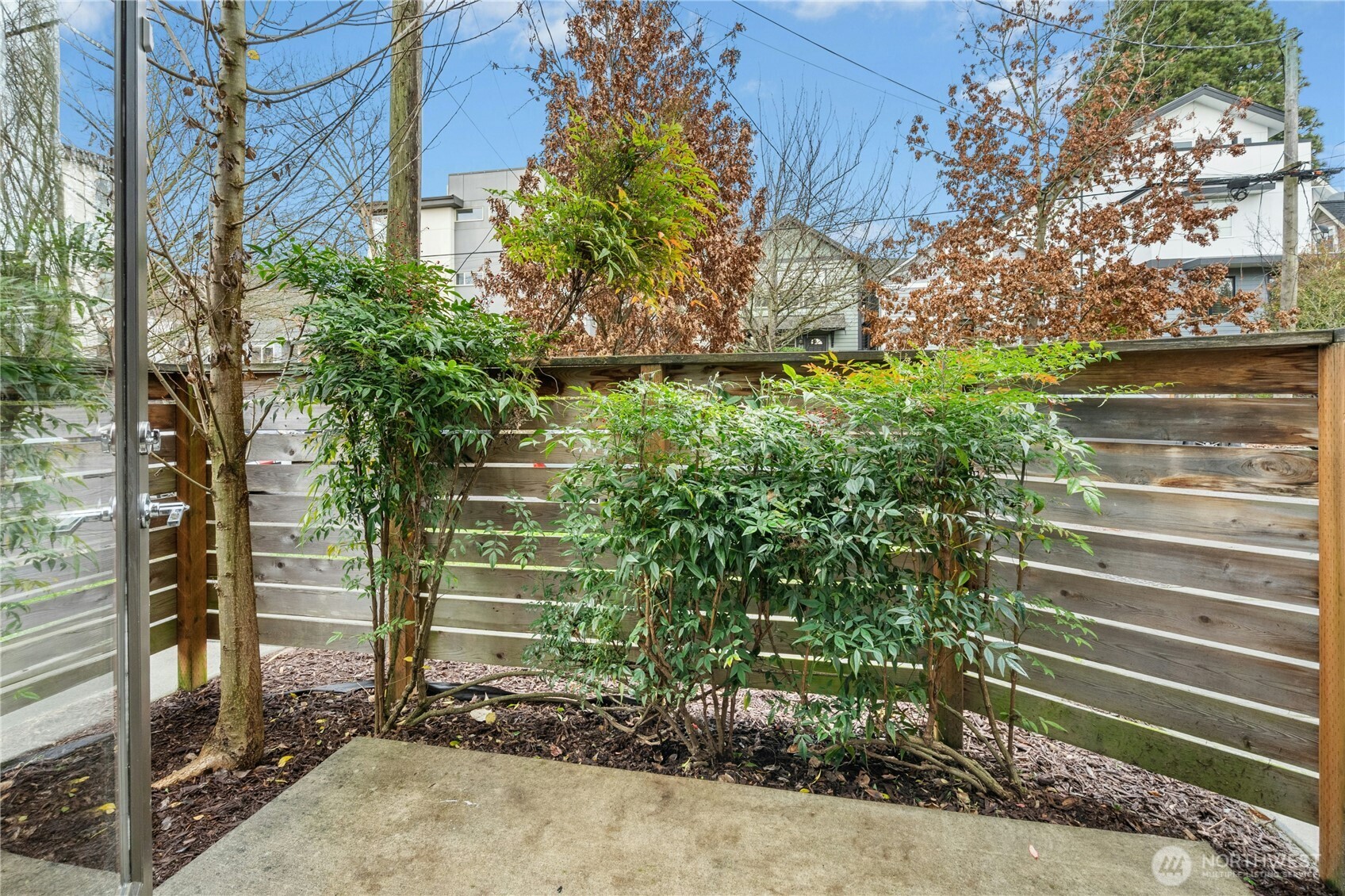 1743 Northwest 60th Street, Unit A Seattle, WA 98107 - Photo 20 of 33 a view of a house with a yard