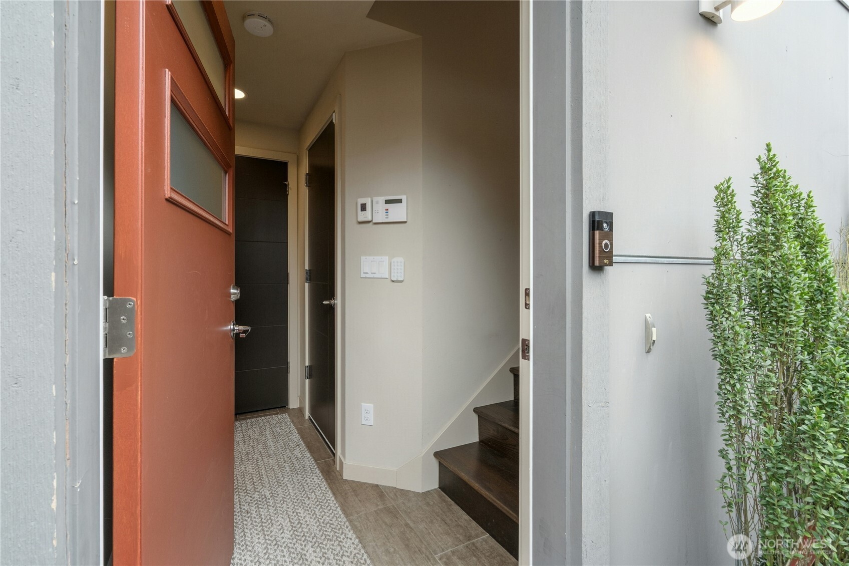 1743 Northwest 60th Street, Unit A Seattle, WA 98107 - Photo 2 of 33 a view of a hallway with wooden floor and entryway