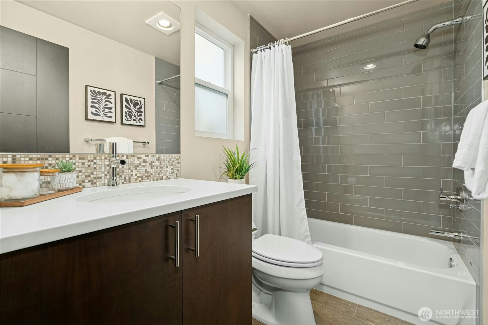 1743 Northwest 60th Street, Unit A Seattle, WA 98107 - Photo 21 of 33 a bathroom with a sink a toilet and shower