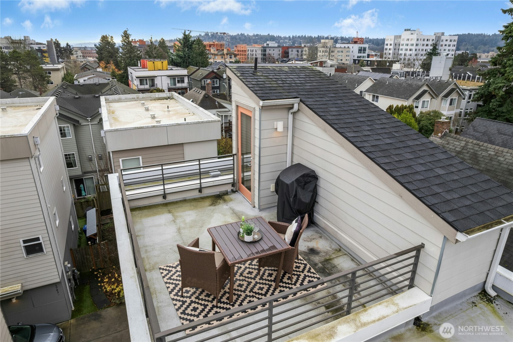 1743 Northwest 60th Street, Unit A Seattle, WA 98107 - Photo 24 of 33 a view of a terrace with seating area