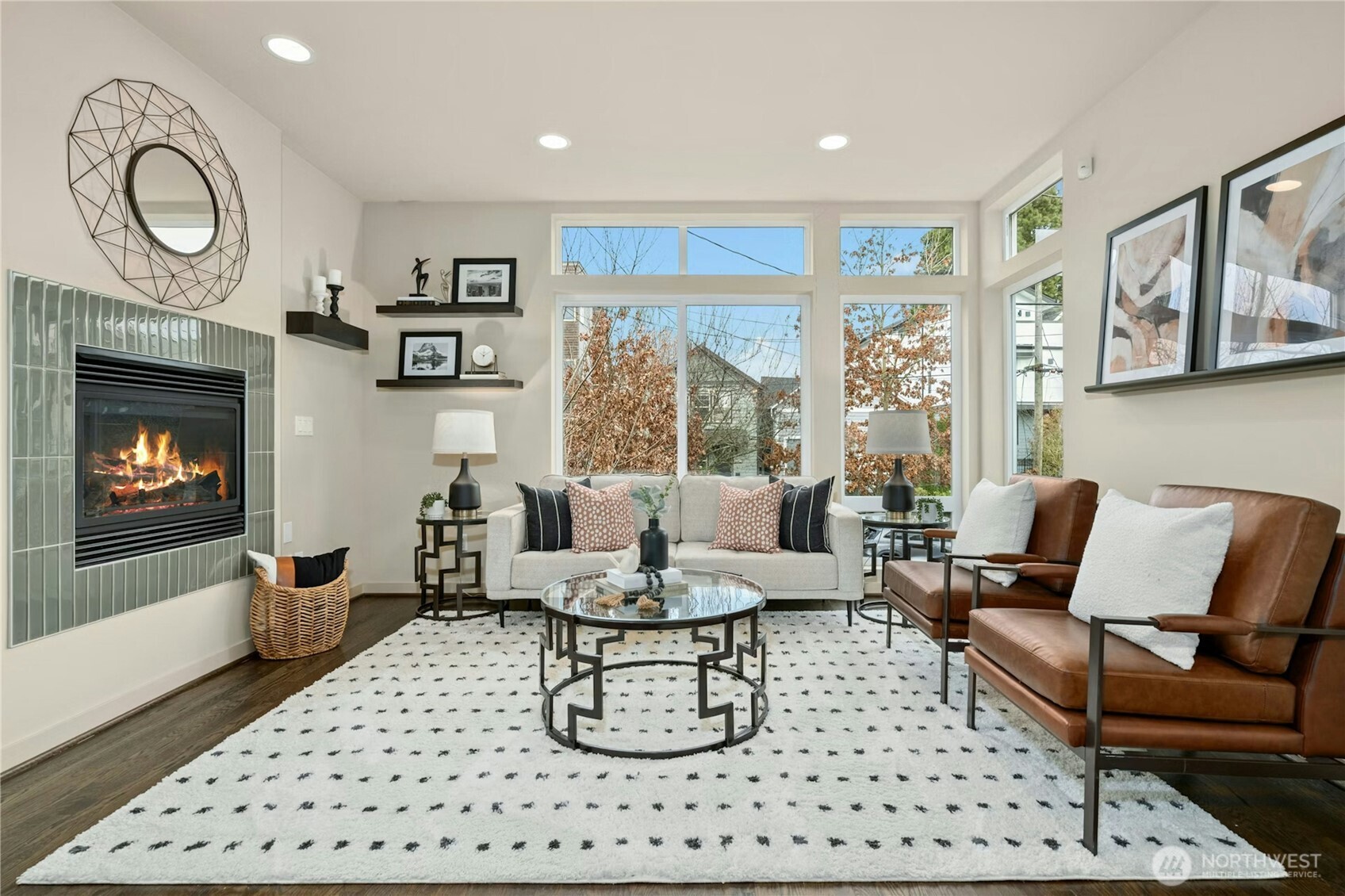 1743 Northwest 60th Street, Unit A Seattle, WA 98107 - Photo 4 of 33 a living room with furniture a fireplace and a large window