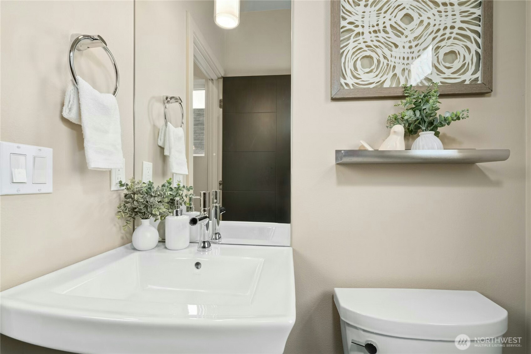 1743 Northwest 60th Street, Unit A Seattle, WA 98107 - Photo 9 of 33 a bathroom with a sink mirror and toilet