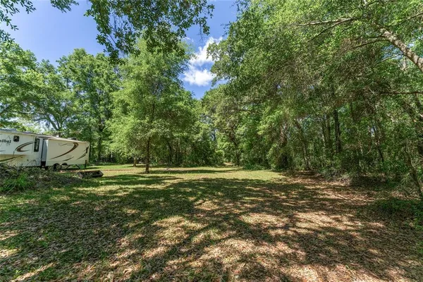 a view of a lake with a yard