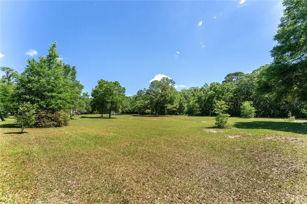 a view of an ocean and a yard