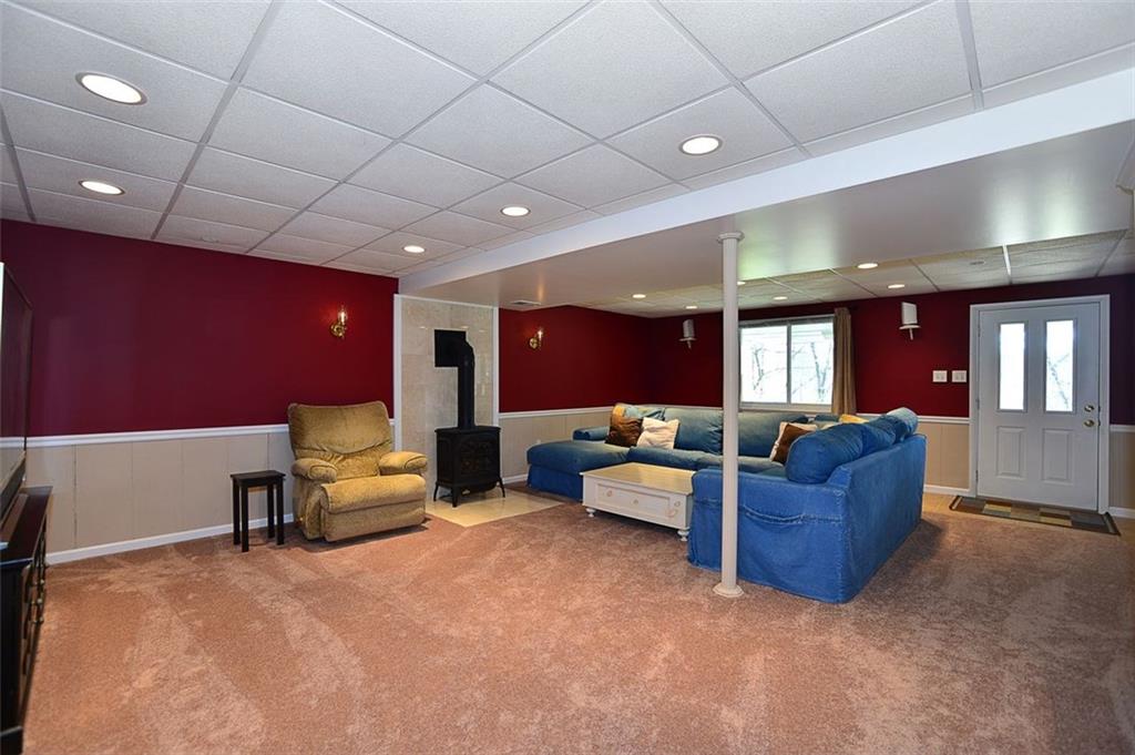 102 Deer Road Pittsburgh, PA 15237 - Photo 14 of 21 Awesome 25x18 lower level Family room! Features gas fireplace, new carpet and walk out to covered patio.
