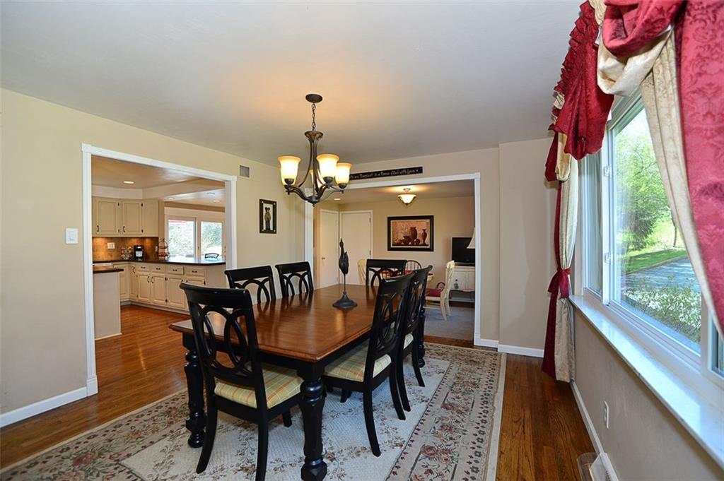 102 Deer Road Pittsburgh, PA 15237 - Photo 4 of 21 14x12 Dining room - features refinished hardwood floors and updated light fixture. Opens to Kitchen creating spacious area for entertaining.