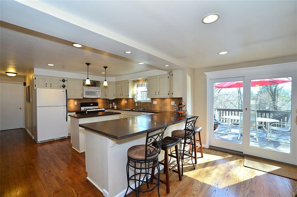 102 Deer Road Pittsburgh, PA 15237 - Photo 6 of 21 24x13 Kitchen - Solid surface counter tops - Recessed and under cabinet lighting - Access to deck via newer sliding glass door (2008)