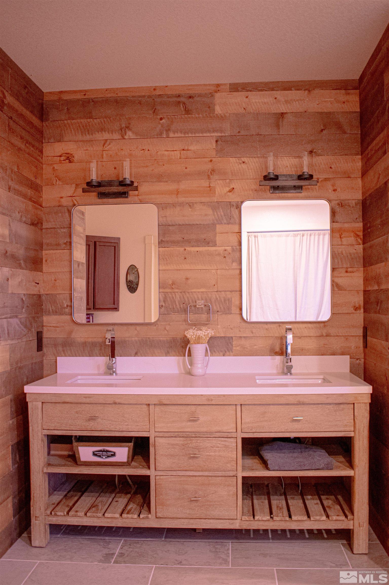 400 Desert Sun Lane Reno, NV 89508 - Photo 18 of 40 a bathroom with a sink and a mirror