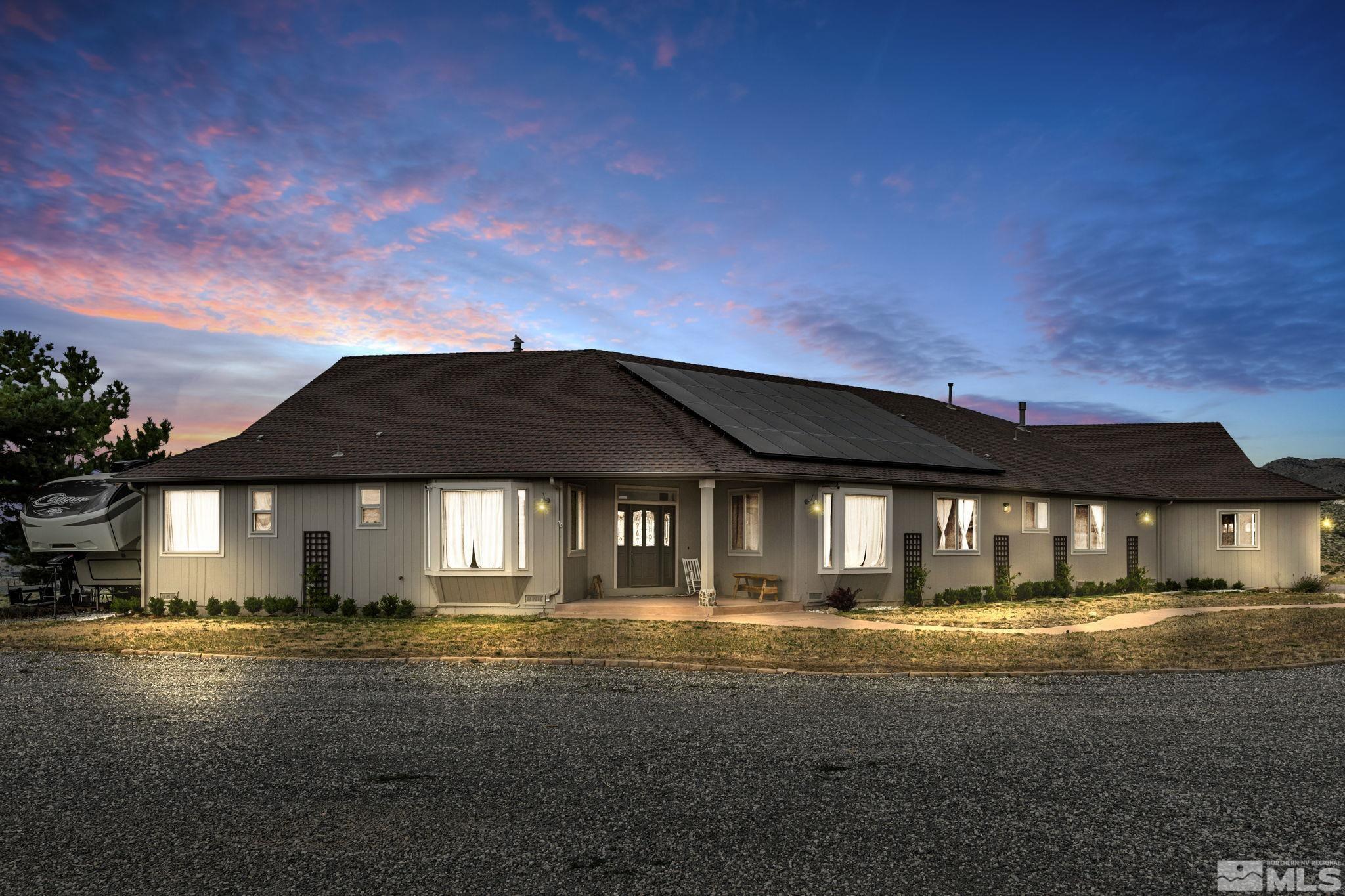 400 Desert Sun Lane Reno, NV 89508 - Photo 2 of 40 a front view of a house with a yard