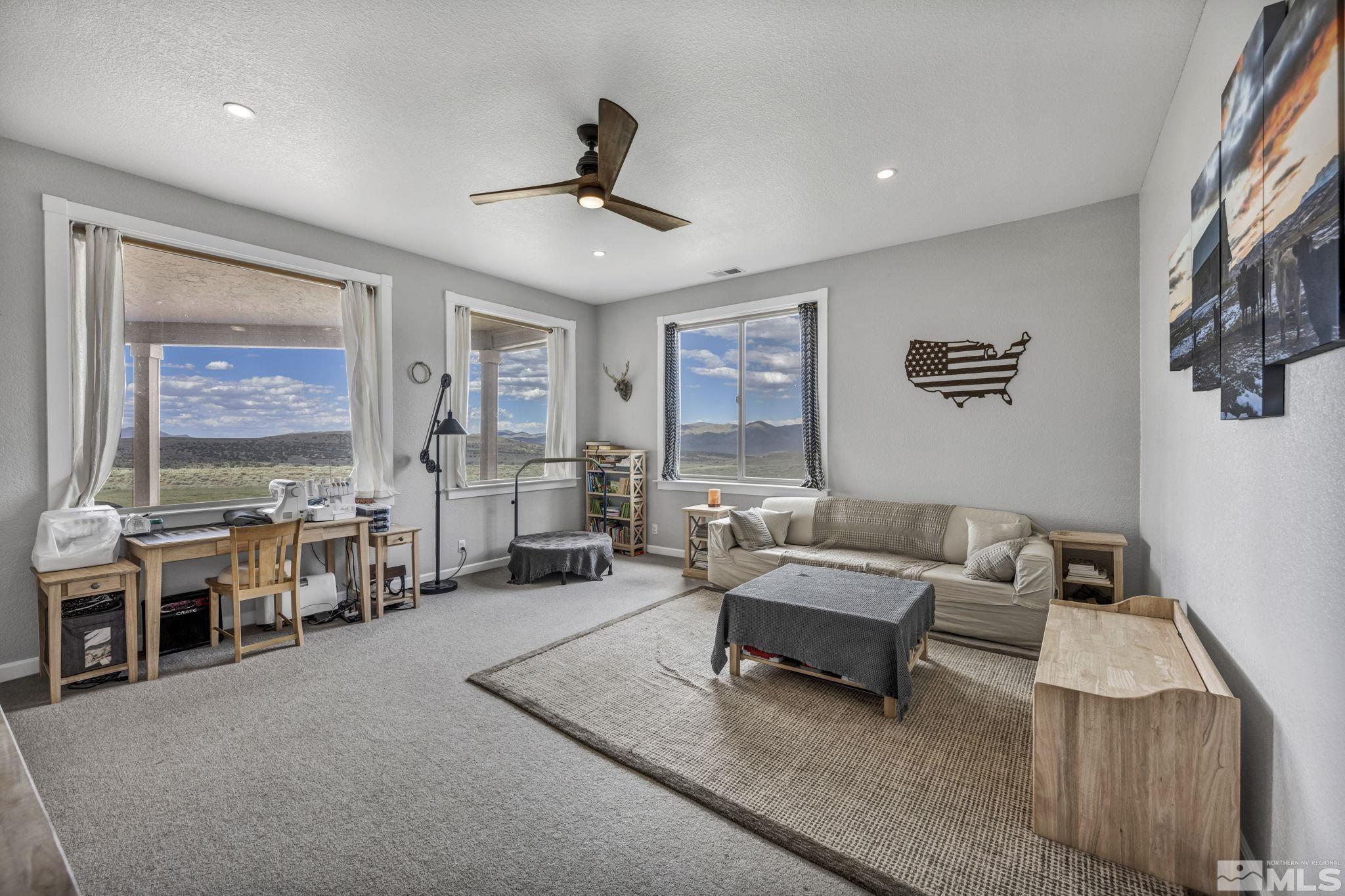 400 Desert Sun Lane Reno, NV 89508 - Photo 21 of 40 a living room with furniture and a large window