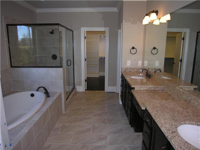 3206 Appian Way, Unit 72 Spring Hill, TN 37174 - Photo 9 of 12 Elegant, staggered pattern, on the tile floor, in master bath. Spacious Master bath, features a large walk-in shower, extra large vanity wall, & 6' soaking tub.