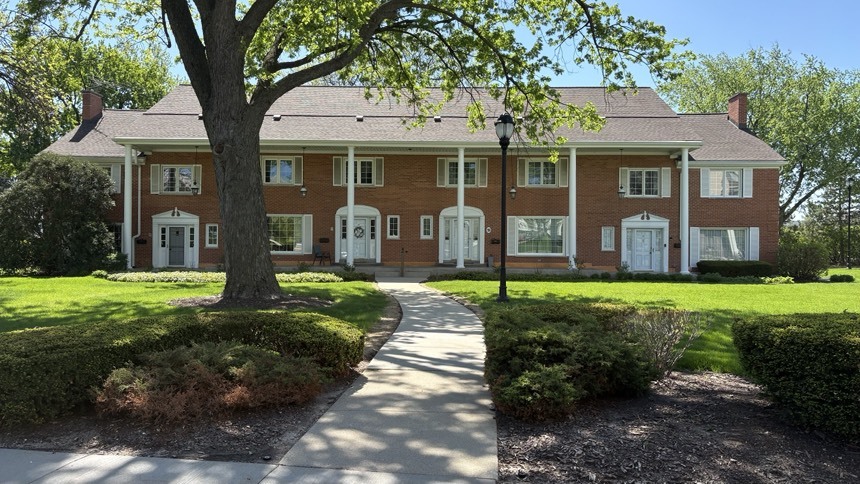 23 North Tower Road Oak Brook, IL 60523 - Photo 1 of 22 a front view of a house with a yard and porch