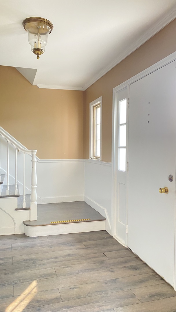 23 North Tower Road Oak Brook, IL 60523 - Photo 15 of 22 a view of an empty room with wooden floor and a window