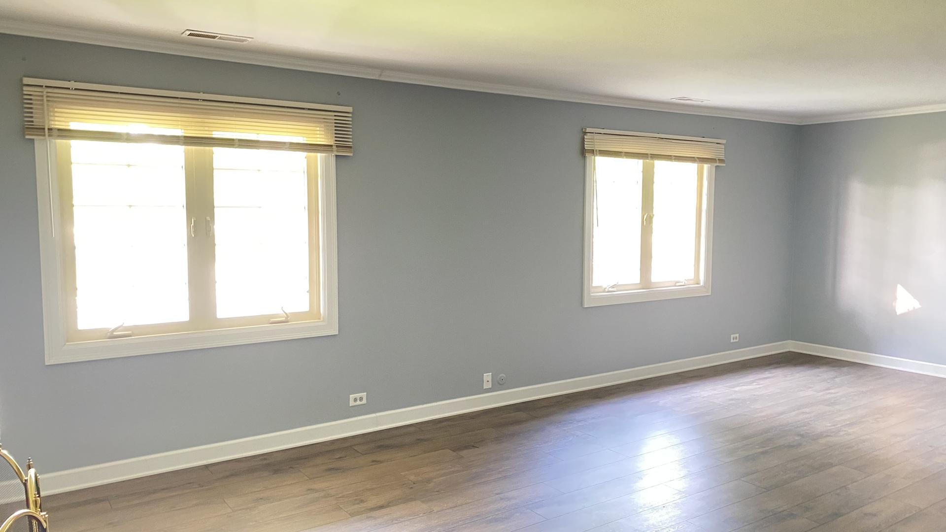 23 North Tower Road Oak Brook, IL 60523 - Photo 16 of 22 a view of an empty room with wooden floor and a window