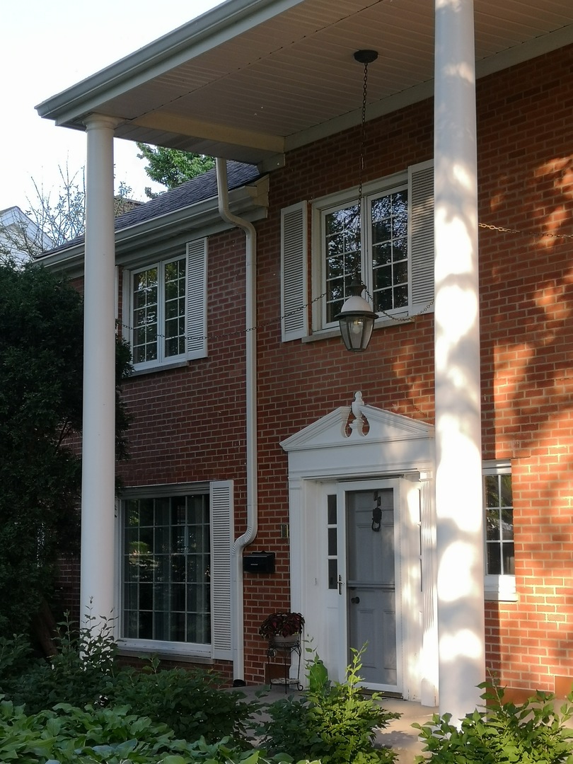 23 North Tower Road Oak Brook, IL 60523 - Photo 3 of 22 a front view of a house with a yard