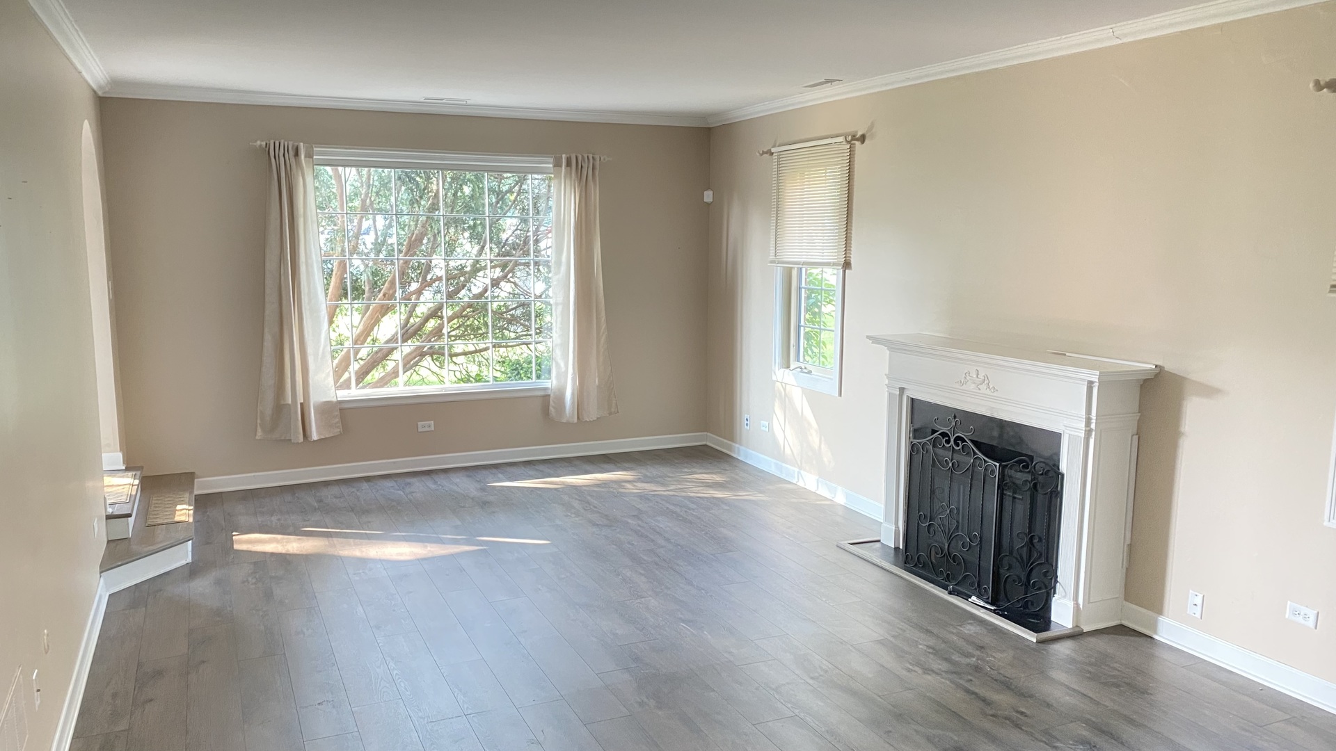 23 North Tower Road Oak Brook, IL 60523 - Photo 9 of 22 an empty room with wooden floor cabinet and windows
