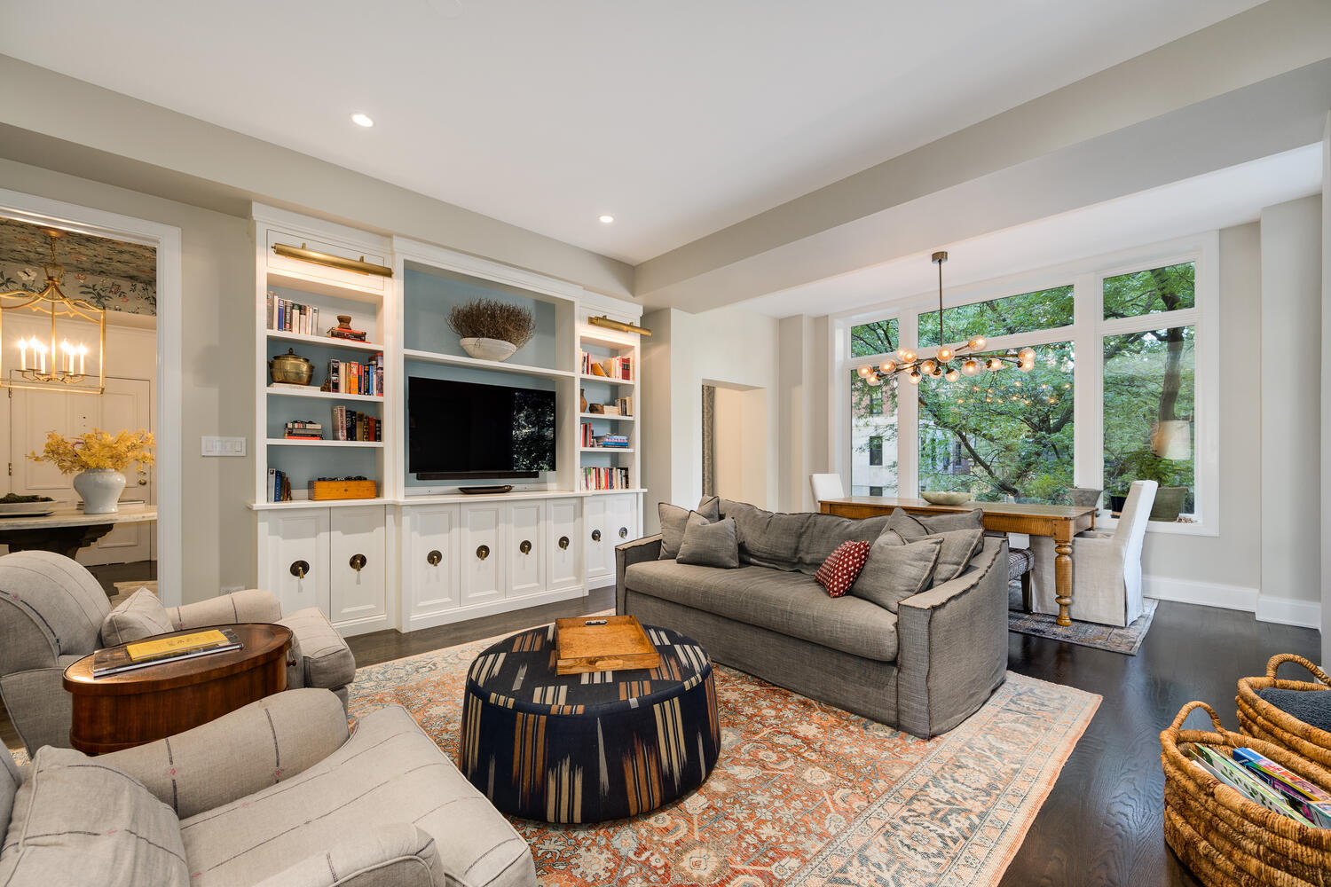 64 East Elm Street, Unit 3 Chicago, IL 60611 - Photo 11 of 30 a living room with furniture flat screen tv and a large window