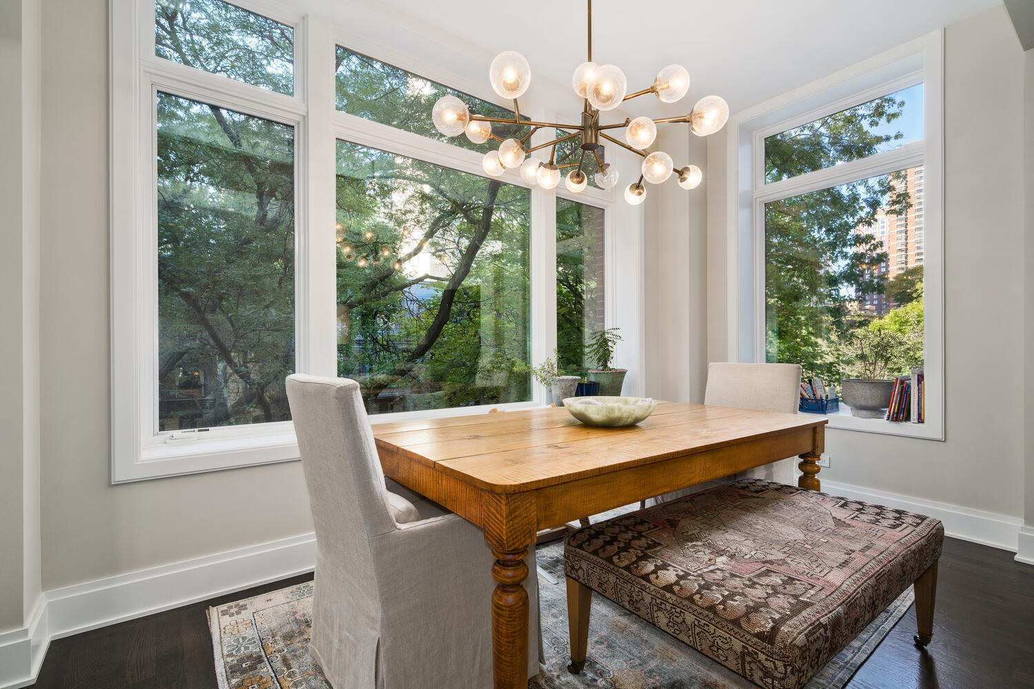 64 East Elm Street, Unit 3 Chicago, IL 60611 - Photo 12 of 30 a view of a dining room with a table and chairs