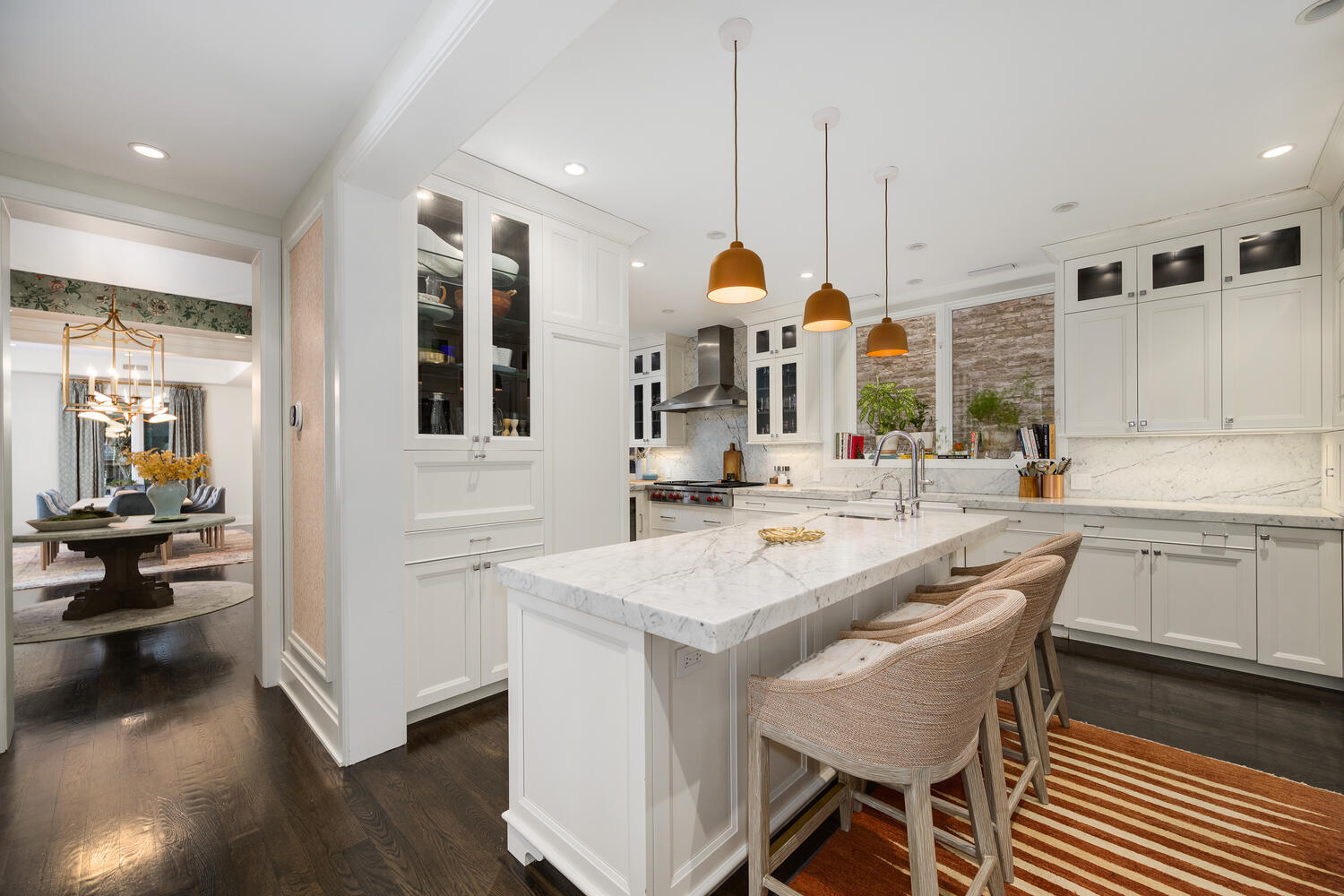 64 East Elm Street, Unit 3 Chicago, IL 60611 - Photo 13 of 30 a kitchen with stainless steel appliances kitchen island granite countertop a sink and cabinets