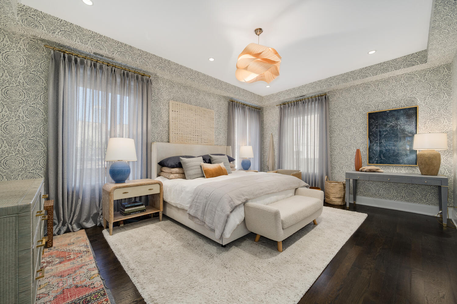 64 East Elm Street, Unit 3 Chicago, IL 60611 - Photo 20 of 30 a spacious bedroom with a bed and a chandelier