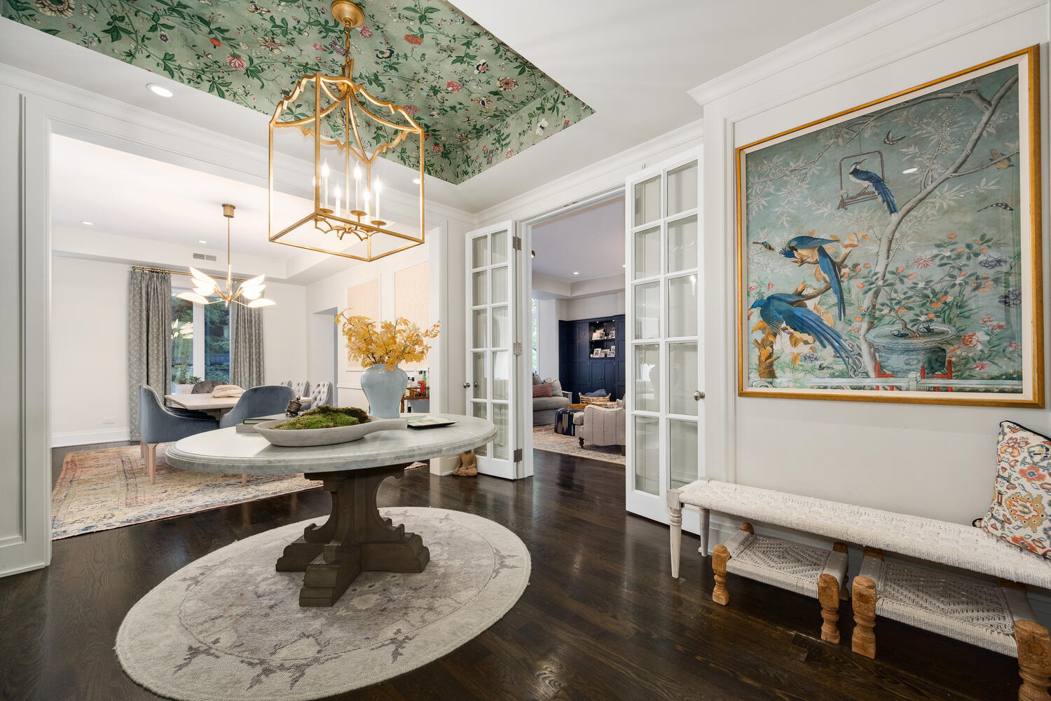 64 East Elm Street, Unit 3 Chicago, IL 60611 - Photo 2 of 30 a dining room with wooden floor a glass table and chairs