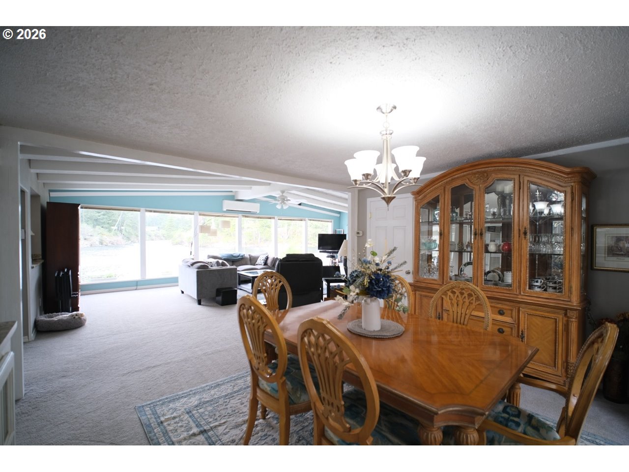 70214 Lakewood Road North Bend, OR 97459 - Photo 14 of 39 a view of a dining room with furniture and chandelier
