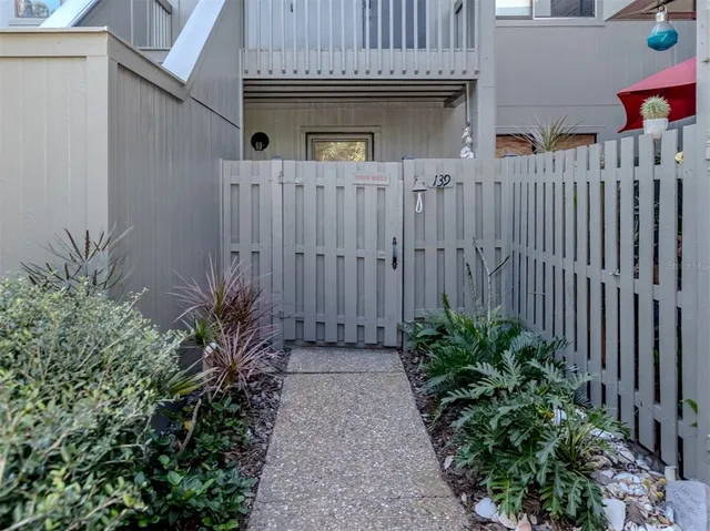 a house with lots of trees in the background