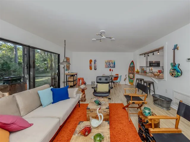 a kitchen with a refrigerator and a stove top oven