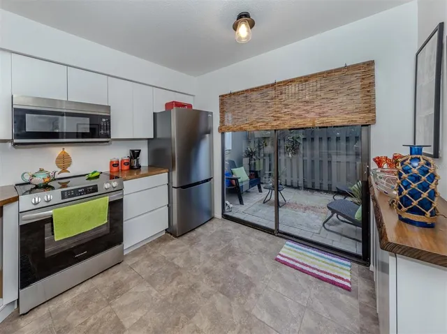 a kitchen with sink and cabinets