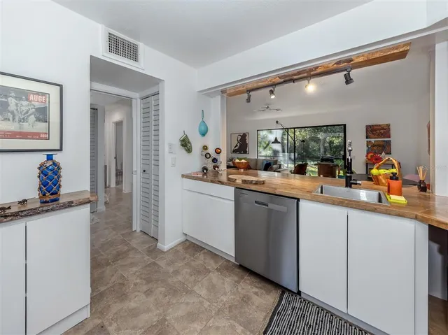 a bathroom with a shower and a sink